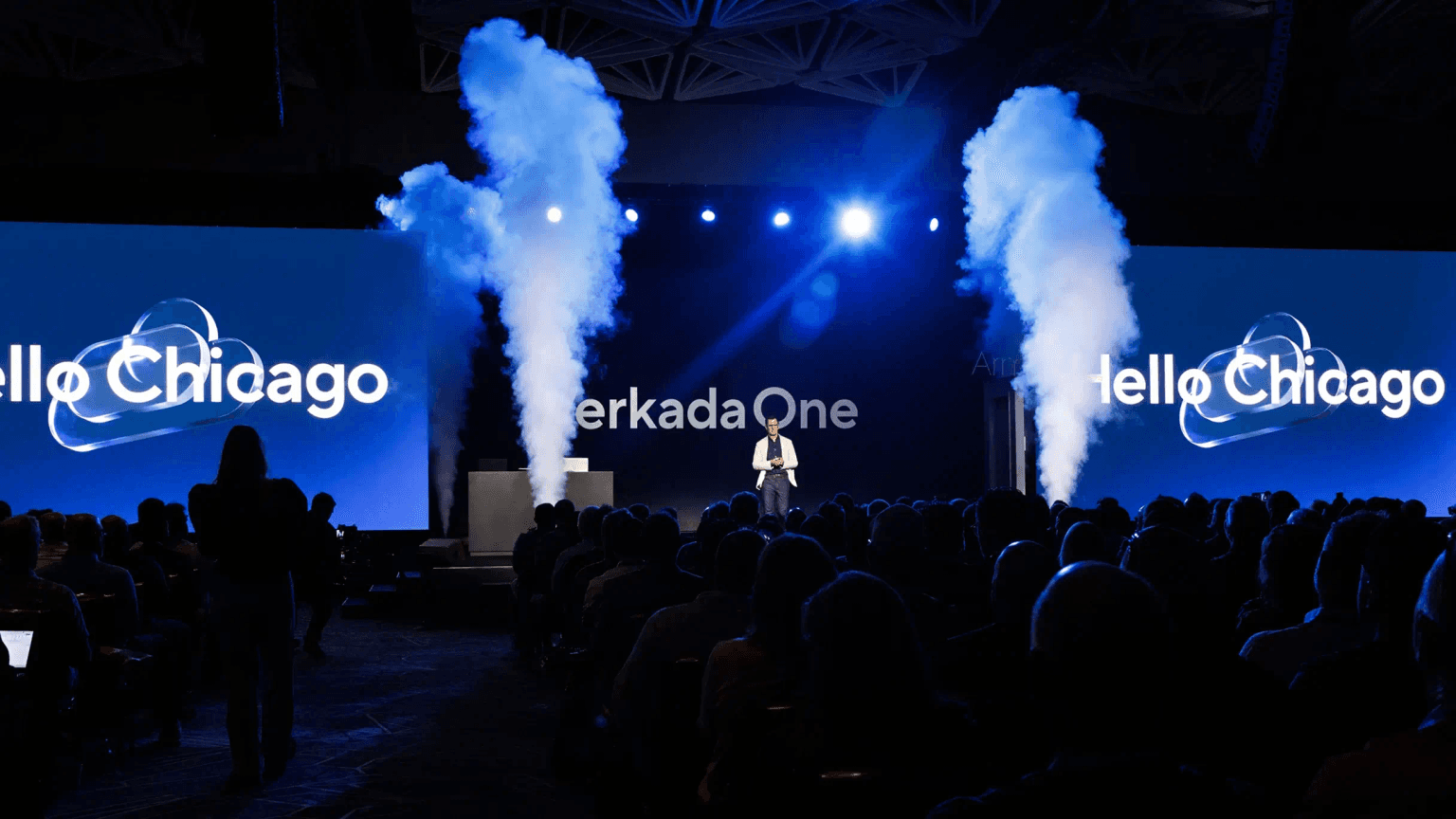 Verkada One 2025 keynote stage with a "Hello Chicago" graphic on screen and a full audience for the conference opening